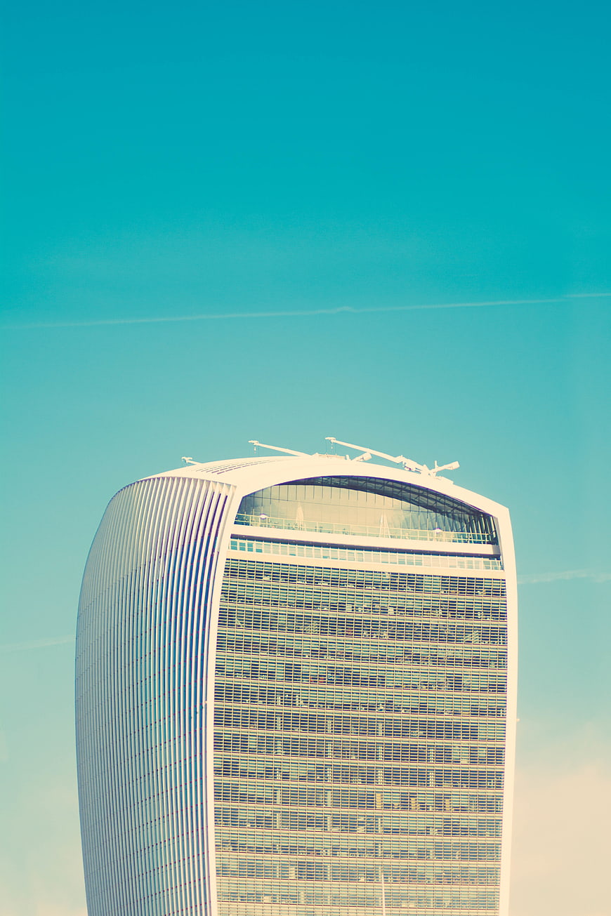 Modern Skyscraper Top Against Blue Sky