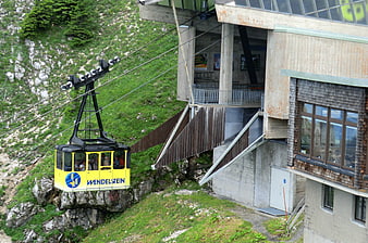 Yellow Wendelstein Cable Car Ascending Green Mountain Slope