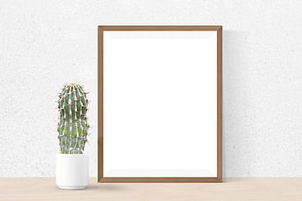 Minimalist Wooden Picture Frame Mockup with Cactus on Desk