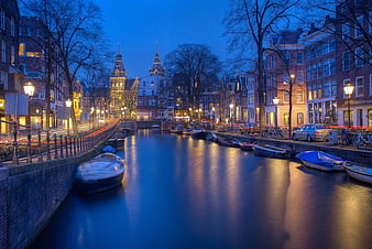 Amsterdam Canal at Blue Hour with Boats and City Lights