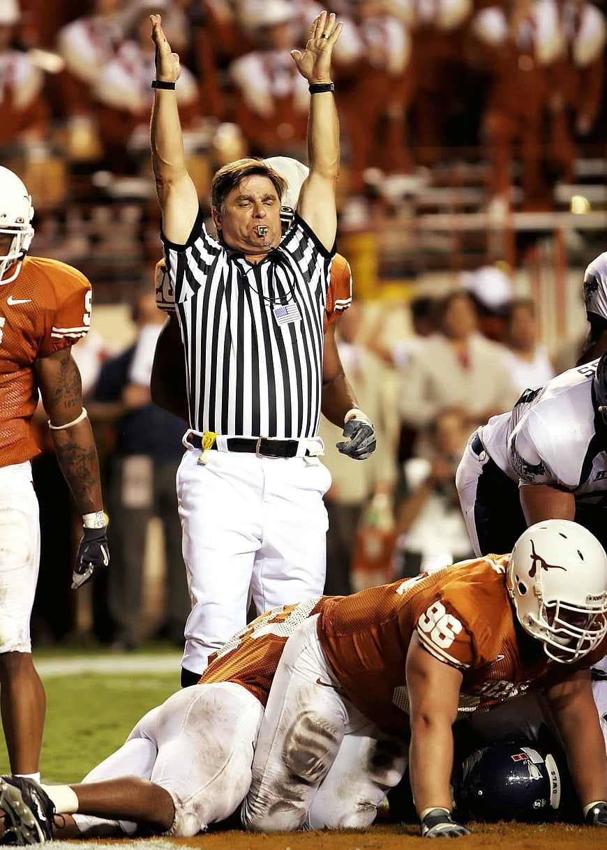 Football Referee Signals Touchdown During College Game
