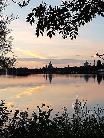 Berlin Cathedral Silhouette at Sunset Over Lake