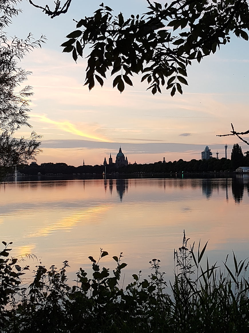 Berlin Cathedral Silhouette at Sunset Over Lake
