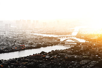 Aerial View of City Skyline and River at Golden Sunset