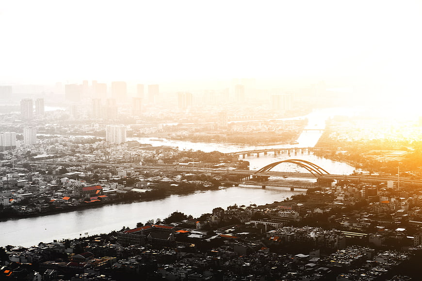 Aerial View of City Skyline and River at Golden Sunset