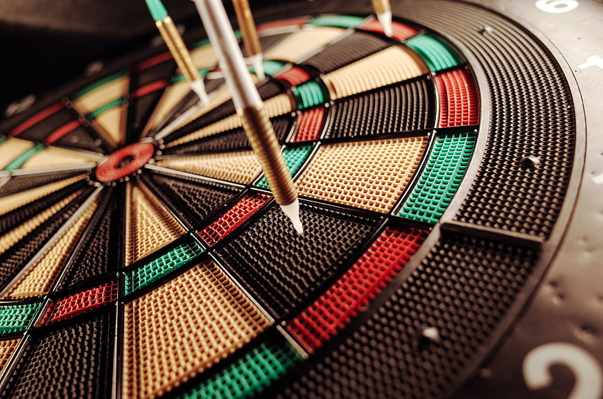 Close-Up of Darts Embedded in a Target Board