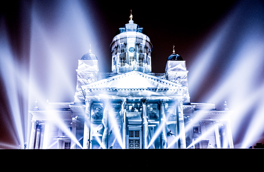 Helsinki Cathedral illuminated by dramatic blue light beams at night
