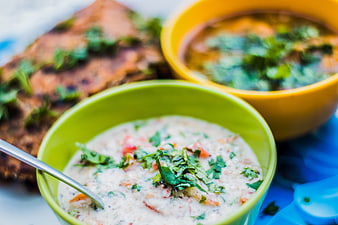 Creamy Indian Raita and Vegetable Curry in Colorful Bowls