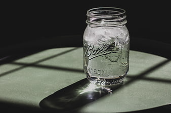 Ball Mason Jar with Ice and Water in Dramatic Light