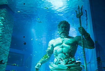 Underwater Poseidon Statue in Aquarium with Fish