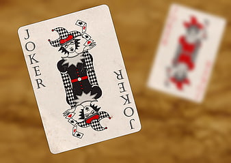 Vintage Joker Playing Card on Wooden Table