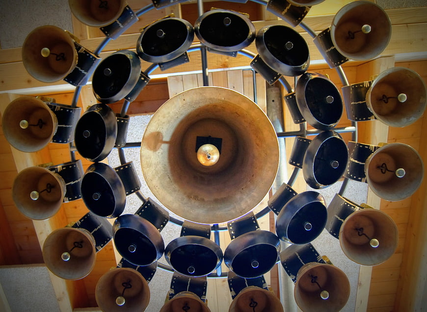 Low angle view of church carillon bells in wooden tower