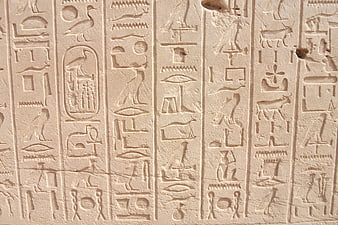 Ancient Egyptian Hieroglyphs Carved on Stone Wall
