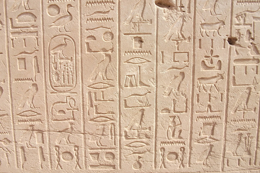 Ancient Egyptian Hieroglyphs Carved on Stone Wall