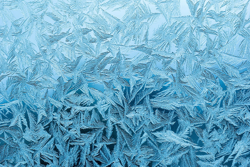 Frost Flower Pattern On Icy Blue Surface