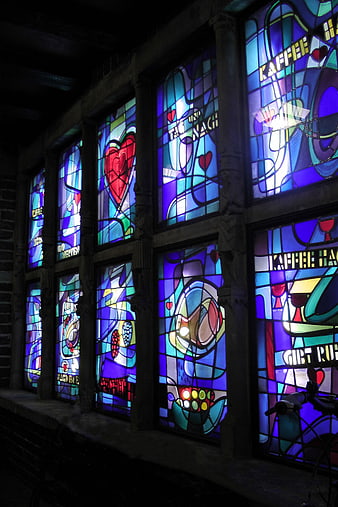 Colorful Stained Glass Windows with Coffee Motifs at Night