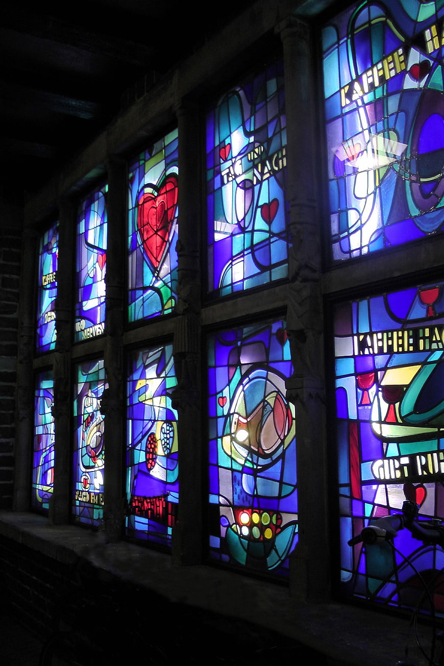 Colorful Stained Glass Windows with Coffee Motifs at Night