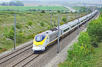 Eurostar High-Speed Train Traveling Through Green Countryside