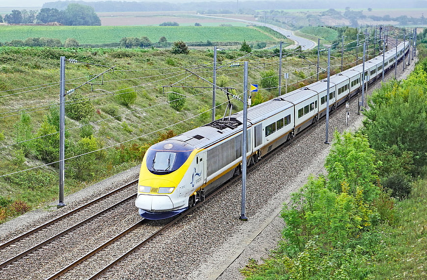 Eurostar High-Speed Train Traveling Through Green Countryside