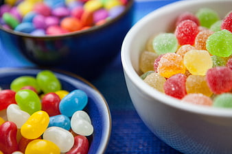 Colorful Jelly Beans and Gummy Sweets in Ceramic Bowls