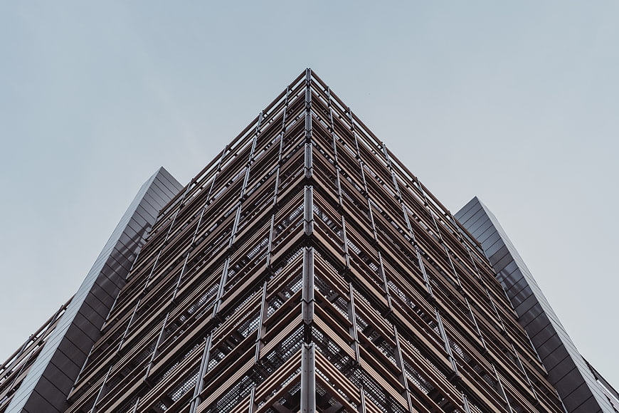 Low angle view of modern skyscraper with geometric facade