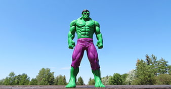 Green Hulk Action Figure Standing Against Blue Sky