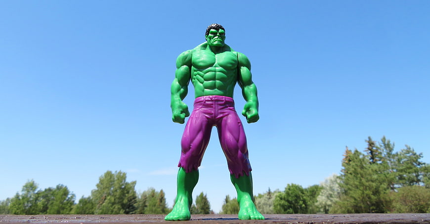 Green Hulk Action Figure Standing Against Blue Sky