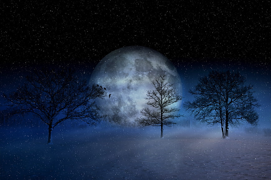 Mystical winter night landscape with giant moon and snow
