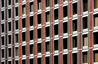 Red Brick Building Facade with Grid of Windows