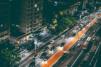 Aerial Night View of Busy City Traffic and Urban Street