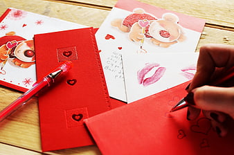 Hand Writing Valentine's Day Card with Red Pen