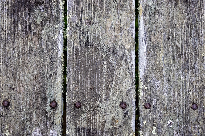 Weathered wooden planks with rusty nails texture background