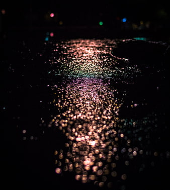 Abstract Bokeh Reflections on Wet Night Surface