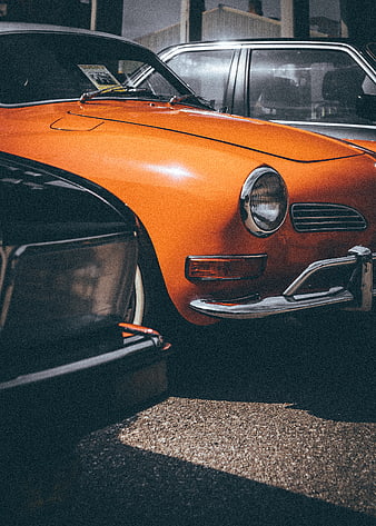 Close-up of vintage orange sports car in garage