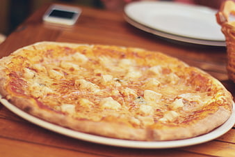 Delicious Chicken and Cheese Pizza on Wooden Table
