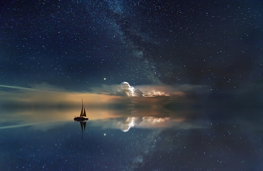 Sailboat Silhouette Under Milky Way Night Sky Reflection