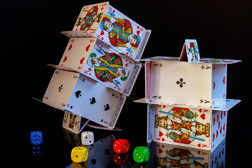 House of Cards and Dice on Black Background