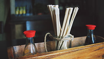 Wooden Chopsticks and Soy Sauce Bottles in Rustic Tray