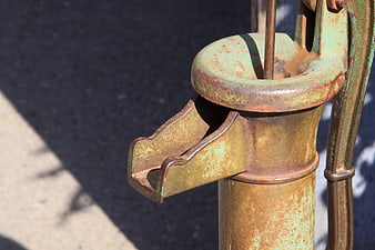 Close-up of Rusty Vintage Green Hand Water Pump