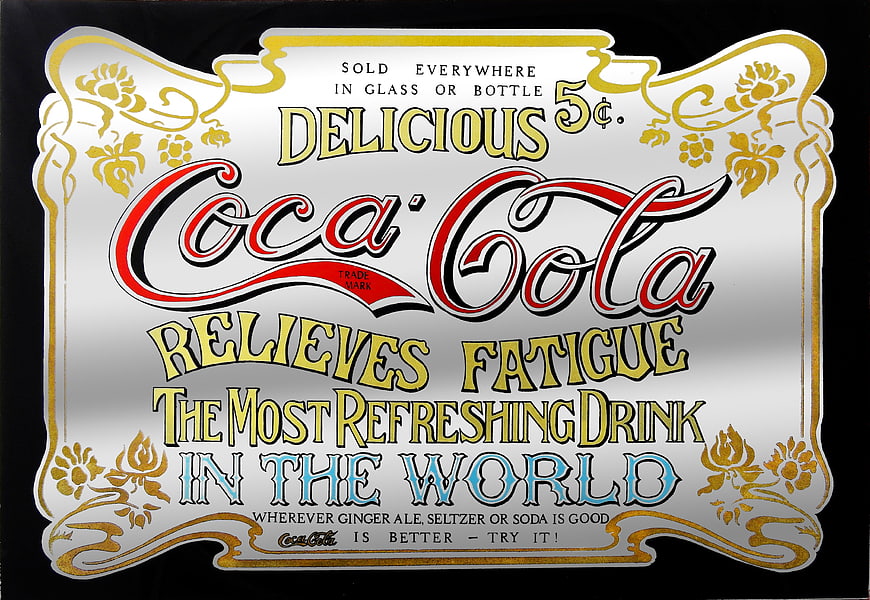 Vintage Coca-Cola Advertising Sign with Ornate Typography