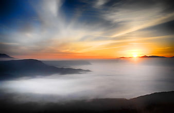 Sunrise over Mountain Range with Sea of Fog