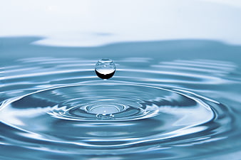 Water Droplet Impacting Surface with Ripples