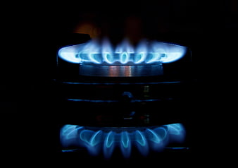 Blue Gas Stove Burner Flames On Black Background