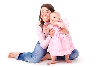 Happy Mother Holding Toddler in Pink Fairy Costume