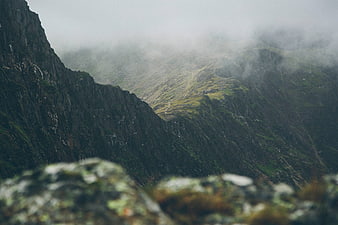 Misty Mountain Landscape with Foreground Rocks