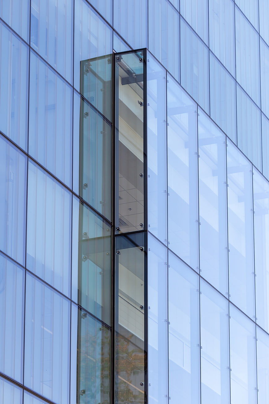 Modern Glass Office Building Facade with Geometric Patterns