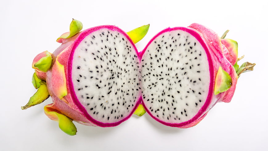 Fresh White Dragon Fruit Cut in Half on White Background