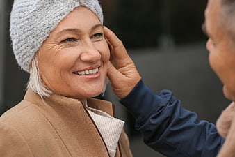 Senior couple sharing affectionate moment outdoors