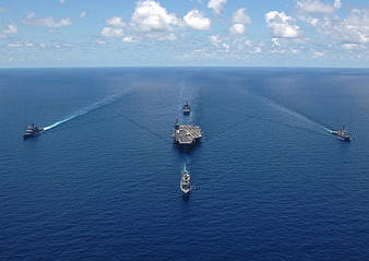 Aerial View of US Navy Carrier Strike Group in Open Ocean