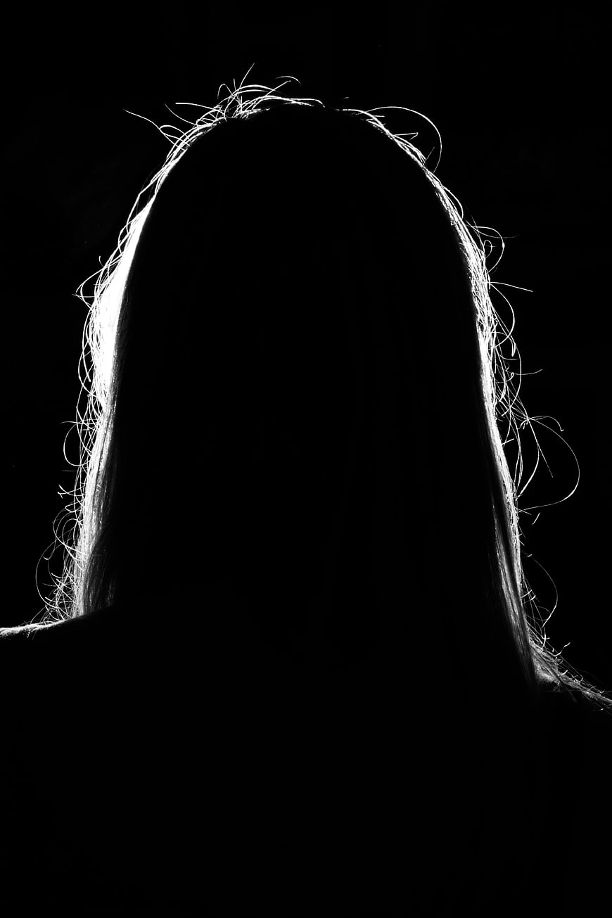 Backlit Silhouette of Woman's Head and Hair